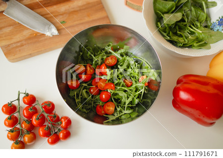 Healthy vegetable salad of fresh tomato, cucumber, onion, spinach, lettuce in a plate. Diet menu. Top view. Healthy vegetable salad of fresh tomato, cucumber, onion, spinach, lettuce in a plate. Diet menu. Top view. 111791671