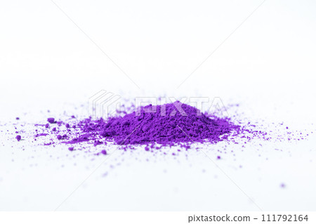 a bunch of dry natural purple pigment on a white background macro a bunch of dry natural purple pigment on a white background macro 111792164