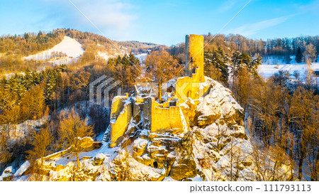 Frydstejn medieval castle ruins at cold morning sunrise time. Bohemian Paradise, Czech: Cesky raj, Czechia. Aerial view from above. 111793113