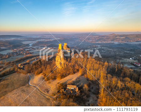 Trosky medieval castle ruins at cold morning sunrise time. Bohemian Paradise, Czech: Cesky raj, Czechia. Aerial view from above. Trosky medieval castle ruins at cold morning sunrise time. Bohemian Paradise, Czech: Cesky raj, Czechia. Aerial view from above. 111793119