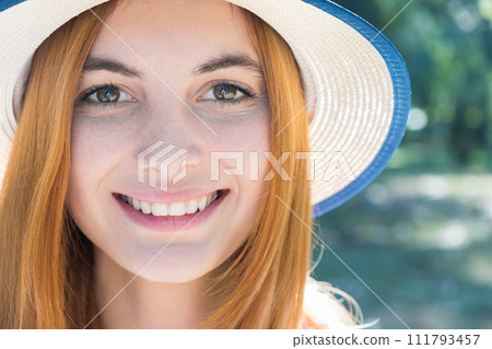 Portrait of gorgeous smiling teenage girl in yellow hat and with red hair outdoors on sunny summer day. Portrait of gorgeous smiling teenage girl in yellow hat and with red hair outdoors on sunny summer day. 111793457