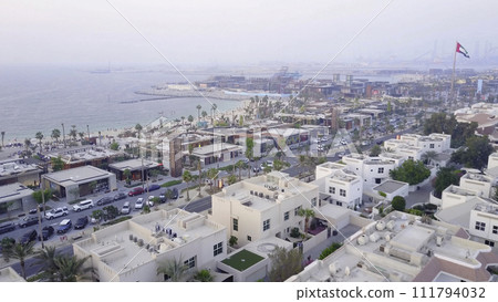 The green oasis. The view from the top of the beach and Arabian Gulf. Top view of beautiful beach coast in Dubai The green oasis. The view from the top of the beach and Arabian Gulf. Top view of beautiful beach coast in Dubai 111794032