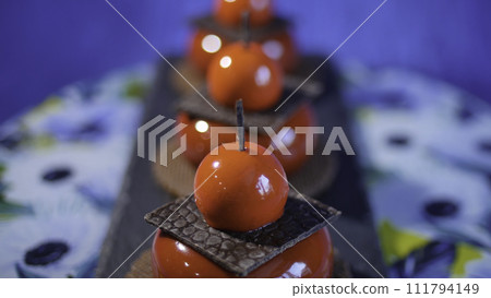 Three red cake with biscuits and chocolate. Tasty red cakes on background dark blue 111794149