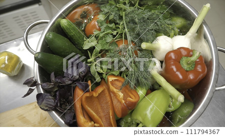 Fresh Raw Spring Vegetables. Clip. Food Vegetarian Background. Tomatoes, Cucumber, Radishes, Lettuce leaves in Metal Basket. Top view. Fresh Raw Spring Vegetables. Clip. Food Vegetarian Background. Tomatoes, Cucumber, Radishes, Lettuce leaves in Metal Basket. Top view. 111794367