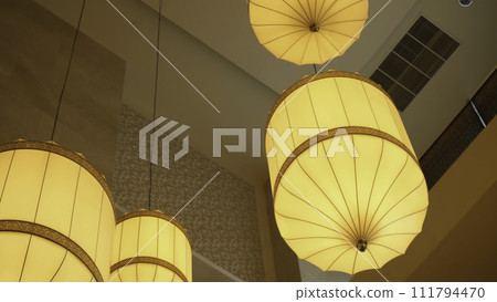 Beautiful chandelier. Luxury expensive chandelier hanging under ceiling. Beautiful luxury expensive chandelier hanging under ceiling in hotel Beautiful chandelier. Luxury expensive chandelier hanging under ceiling. Beautiful luxury expensive chandelier hanging under ceiling in hotel 111794470