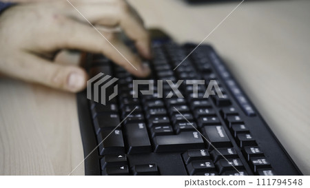 Business, education, programming, people and technology concept ,Businessman working in office hand on keyboard writing a blog or professional manager using portable computer at office close up 111794548