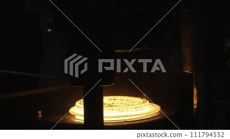 Close up of hydraulic hammer machine shapes the red hot billet at the factiry, heavy metallurgy concept. Scene. The production of metal details at the hot shop of the plant. 111794552
