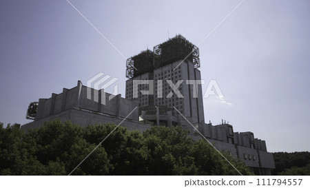 Moscow, Russia, summer city and the building of the Presidium of the Russian Academy of Sciences. Action. Beautiful green trees and a building with unusual structure on the roof. Moscow, Russia, summer city and the building of the Presidium of the Russian Academy of Sciences. Action. Beautiful green trees and a building with unusual structure on the roof. 111794557