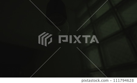 Light bulb without lamp hanging from the ceiling in the dark. Stock footage. Lighting of an old and gloomy with colorful lights on the wall, concept of party. Light bulb without lamp hanging from the ceiling in the dark. Stock footage. Lighting of an old and gloomy with colorful lights on the wall, concept of party. 111794628