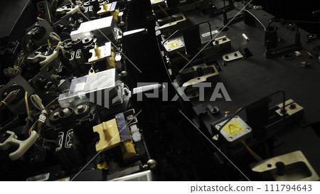 Close up of a complex mechanism of a machine at the factory. Stock footage. Details of an energy plant, morking machine separates its elements. 111794643