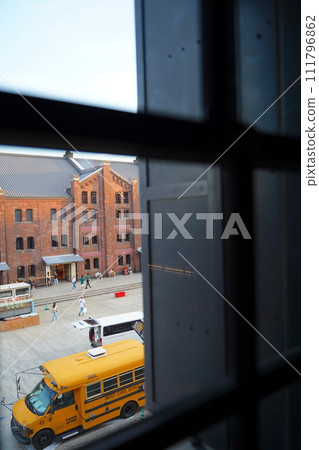 A red brick warehouse in Yokohama, Japan is placed in a window frame 111796862