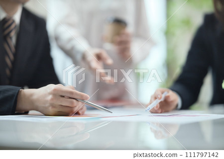 Hands of a business woman having a meeting in the office 111797142
