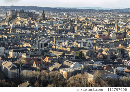 Amazing Edinburgh Cityscape and Edinburgh Castle seen from the top of Salisbury Crags. Amazing Edinburgh Cityscape and Edinburgh Castle seen from the top of Salisbury Crags. 111797606