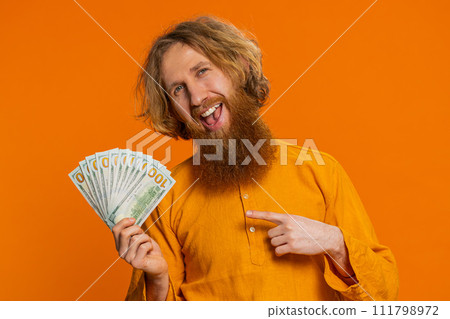 Rich happy man winner waving money dollar cash like a fan, big income wealth success business 111798972