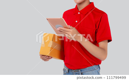 Young asian man carrying box and looking document on digital tablet isolated white background. Young asian man carrying box and looking document on digital tablet isolated white background. 111799499