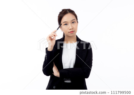 A thoughtful professional young asian woman holding a pen to her face, contemplating. A thoughtful professional young asian woman holding a pen to her face, contemplating. 111799500