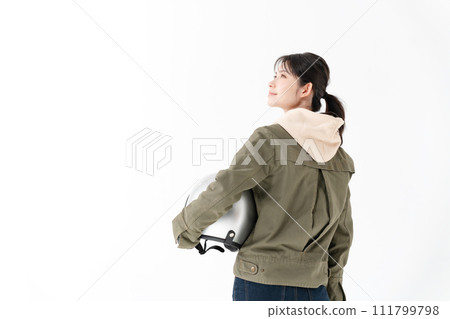 Rear view of a woman with a helmet 111799798