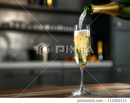 Pouring Champagne into the Champagne glass on the wooden table against blur room background Pouring Champagne into the Champagne glass on the wooden table against blur room background 111800131