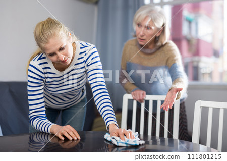 Mature woman scolds her adult daughter 111801215