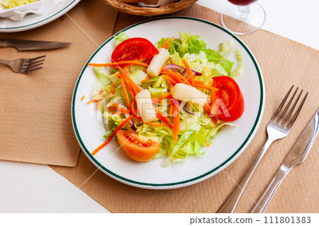 Fresh healthy salad with assorted greens and vegetables 111801383