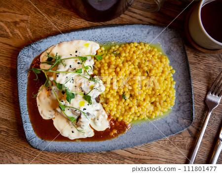 Dish of beef cheeks with creamy mushroom sauce and ptitim paste. 111801477
