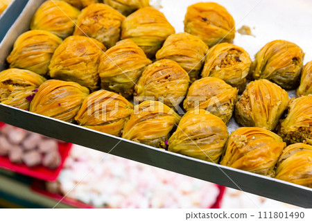 Traditional Turkish baklava from filo pastry for sale Traditional Turkish baklava from filo pastry for sale 111801490