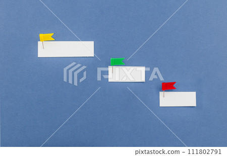 Blank paper notes are pinned to board. Business management and business solutions. Overcoming the barriers. Conquering the obstacles. Way to success. 111802791