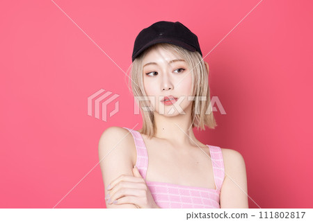Pop portrait of a young woman shot against a pink background 111802817