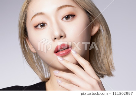 Cool portrait of young high-toned woman wearing black jacket Cool portrait of young high-toned woman wearing black jacket 111802997