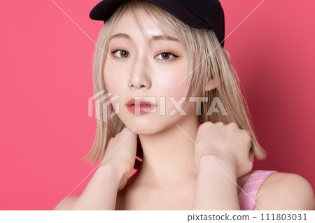 Pop portrait of a young woman shot against a pink background 111803031