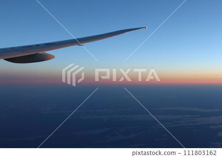 A sunset glow seen from an airplane A sunset glow seen from an airplane 111803162