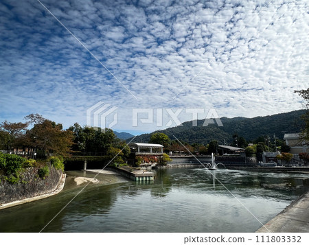 river and scale clouds 111803332