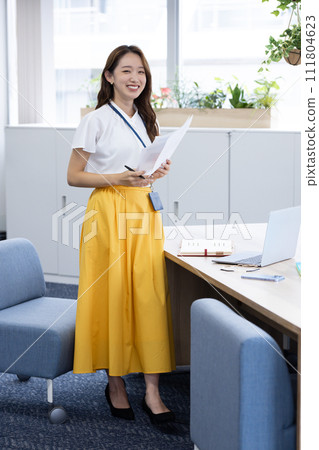 Young woman working in a business office Young woman working in a business office 111804623