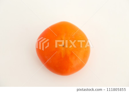 The butt side of a persimmon photographed against a white background 111805855
