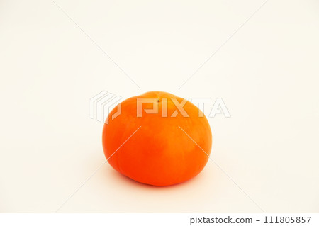 The butt side of a persimmon photographed against a white background 111805857