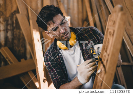professional carpenter man hand working make wooden handcraft furniture master workpiece fine detail artisan with wood workshop. 111805878