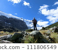 Rear view of a male climber looking at the peak of Rob Roy Glacier, New Zealand 111806549