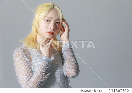Blonde young woman wearing street fashion Blonde young woman wearing street fashion 111807860