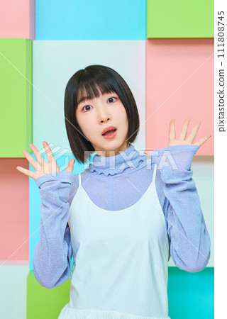 A young woman with a surprised expression 111808745