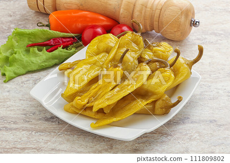 Pickled marinated spicy green pepper Pickled marinated spicy green pepper 111809802