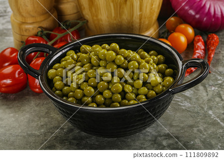 Sweet canned young green peas 111809892