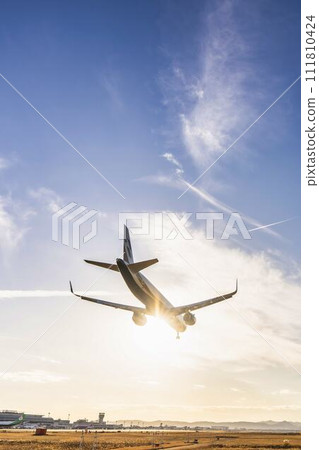 Sendai Airport at dusk, airplane landing, Natori City, Miyagi Prefecture Sendai Airport at dusk, airplane landing, Natori City, Miyagi Prefecture 111810424