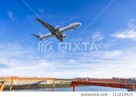 Sendai Airport at dusk, airplane landing, Natori City, Miyagi Prefecture Sendai Airport at dusk, airplane landing, Natori City, Miyagi Prefecture 111810425