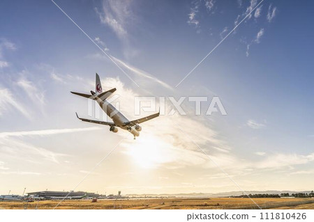 Sendai Airport at dusk, airplane landing, Natori City, Miyagi Prefecture Sendai Airport at dusk, airplane landing, Natori City, Miyagi Prefecture 111810426