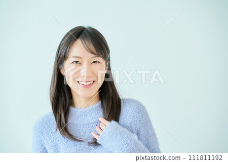 White background with smiling young woman 111811192
