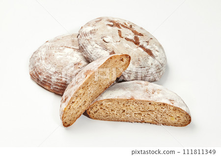 Artisan wheat bread loaves isolated on white background 111811349
