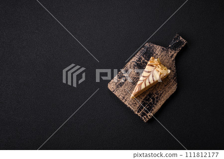 Piece of delicious sweet esterhazy cake with nuts and cream 111812177