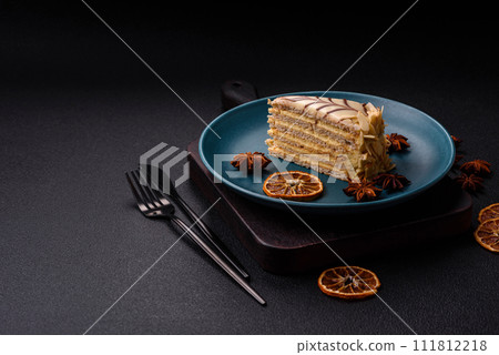 Piece of delicious sweet esterhazy cake with nuts and cream Piece of delicious sweet esterhazy cake with nuts and cream 111812218