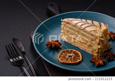 Piece of delicious sweet esterhazy cake with nuts and cream 111812223