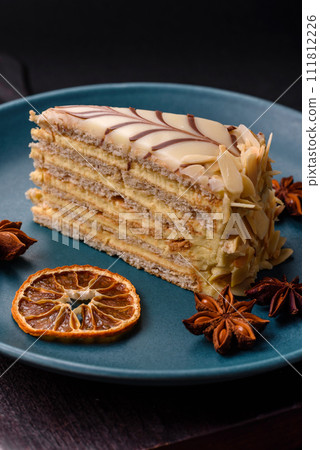Piece of delicious sweet esterhazy cake with nuts and cream Piece of delicious sweet esterhazy cake with nuts and cream 111812226